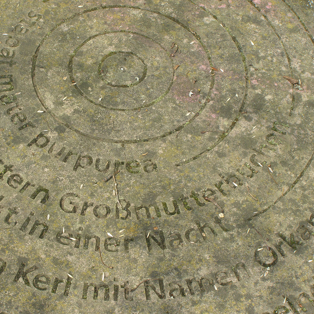 Mühlstein-mit-Inschrift